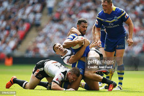 Ryan Atkins of the Warrington Wolves is tackled during the Ladbrokes Challenge Cup Final between Hull FC and Warrington Wolves at Wembley Stadium on...