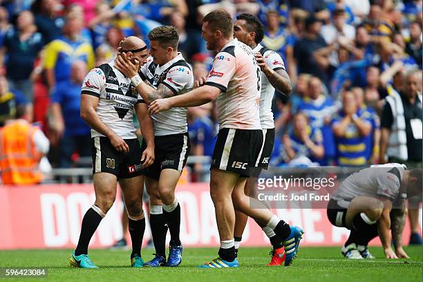 Danny Houghton of Hull FC is congratulated by teammates after preventing try during the Ladbrokes Challenge Cup Final between Hull FC and Warrington...