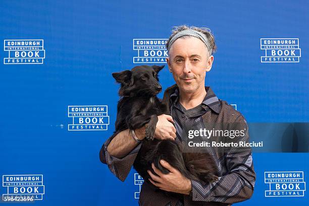 Scottish actor and author Alan Cumming attends a photocall together with his dog Lala at Edinburgh International Book Festival at Charlotte Square...