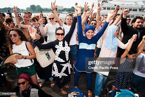 Group portrait of the people gathered in Antwerp at the beach party to protest against the ban of Burkini's in France.