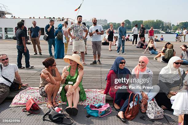 People gathered in Antwerp at the beach party to protest against the ban of Burkini's in France.