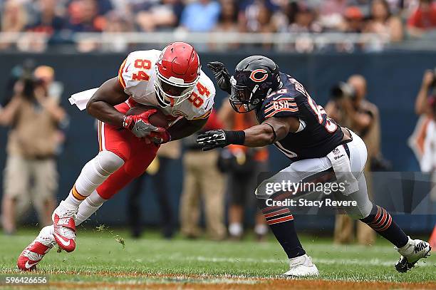 Demetrius Harris of the Kansas City Chiefs is pursued by Jerrell Freeman of the Chicago Bears during a preseason game at Soldier Field on August 27,...
