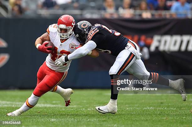 Anthony Sherman of the Kansas City Chiefs is brought down by Danny Trevathan of the Chicago Bears during a preseason game at Soldier Field on August...