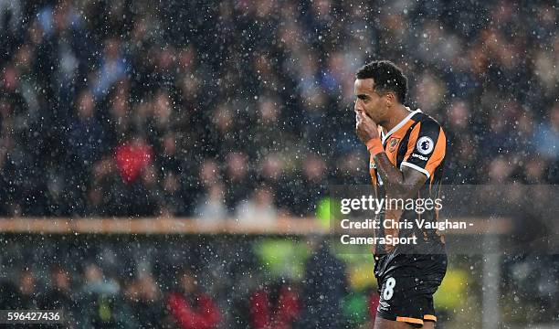 Hull City's Tom Huddlestone reacts after he saw a shot on goal deflected wide during the Premier League match between Hull City and Manchester United...