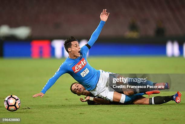 Napoli's player Jose Maria Callejon vies with AC Milan player Giacomo Bonaventura during the Serie A match between SSC Napoli and AC Milan at Stadio...