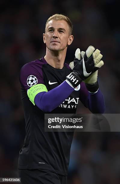 Joe Hart of Manchester City applauds the fans after the UEFA Champions League Play Off, 2nd leg between Manchester City and FC Steaua Bucharest at...