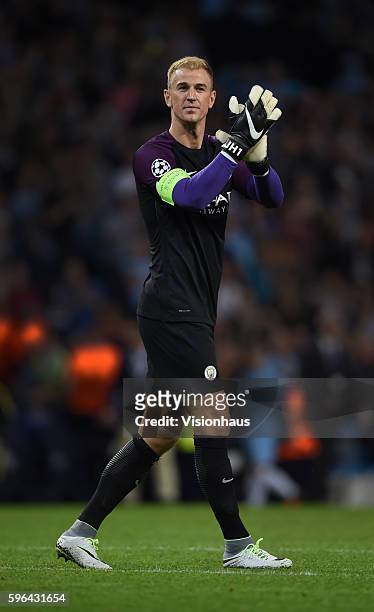 Joe Hart of Manchester City applauds the fans after the UEFA Champions League Play Off, 2nd leg between Manchester City and FC Steaua Bucharest at...