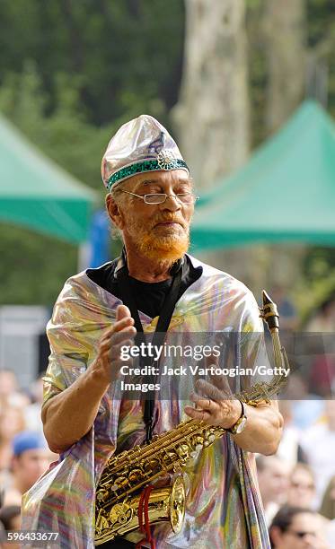 American Jazz musician and bandleader Marshall Allen plays on alto saxophone as he leads the Sun Ra Arkestra during a performance at Central Park...