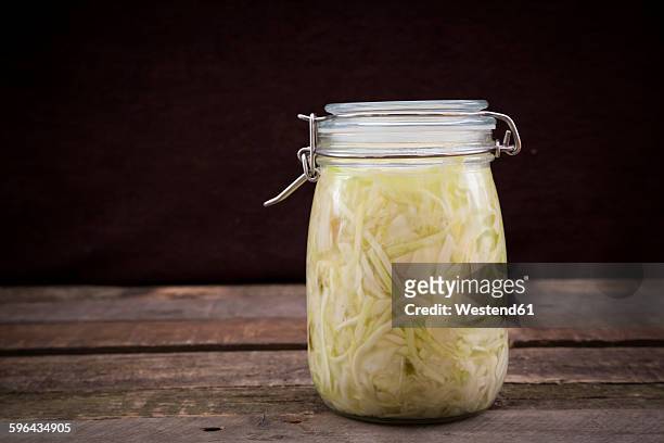 homemade sauerkraut in preserving jar - choucroute stock-fotos und bilder