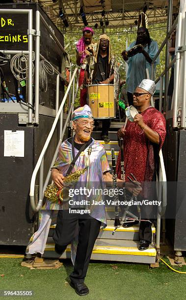 American Jazz musician and bandleader Marshall Allen plays on alto saxophone as he leads the Sun Ra Arkestra off the stage during a performance at...