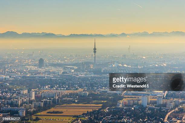 germany, bavaria, munich, cityscape with alps in background - olympiapark münchen stock-fotos und bilder