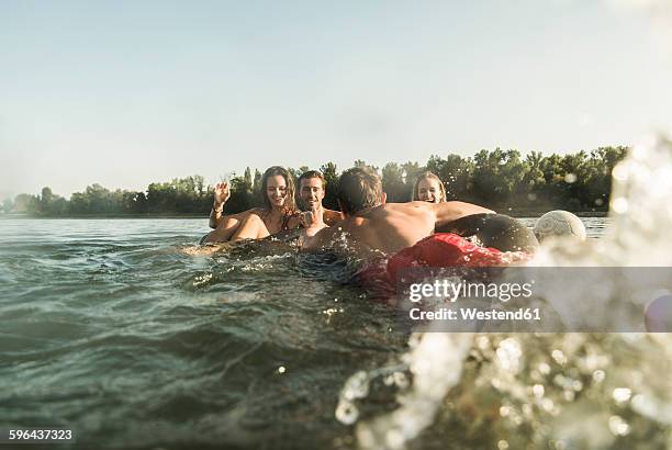 happy friends in water - river bathing imagens e fotografias de stock