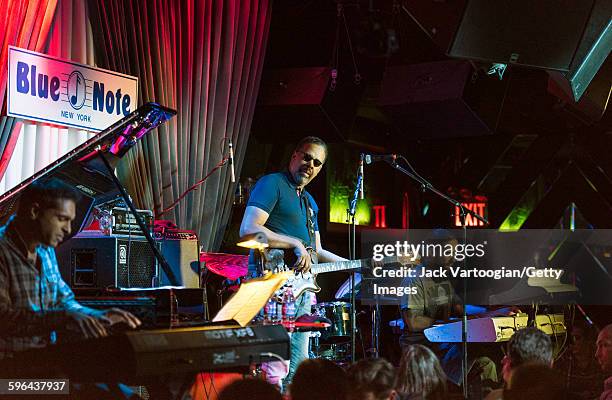 American Jazz musician Stanley Clarke plays elctric bass as he leads his band at the Blue Note nightclub, New York, New York, November 4, 2015. With...