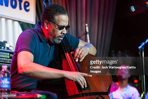 American Jazz musician Stanley Clarke plays upright acoustic bass as he leads his band at the Blue Note nightclub, New York, New York, November 4,...