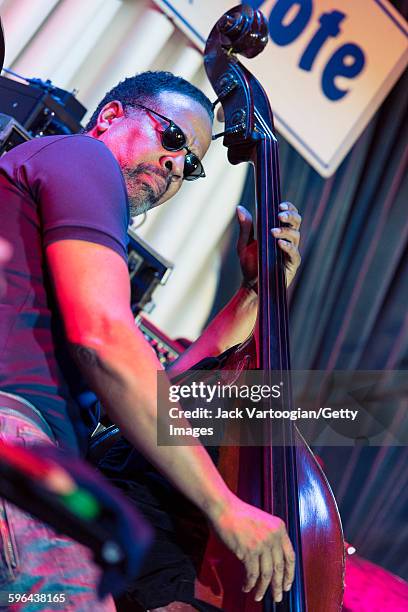 American Jazz musician Stanley Clarke plays upright acoustic bass as he leads his band at the Blue Note nightclub, New York, New York, November 4,...