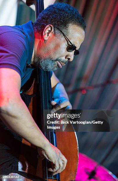 American Jazz musician Stanley Clarke plays upright acoustic bass as he leads his band at the Blue Note nightclub, New York, New York, November 4,...