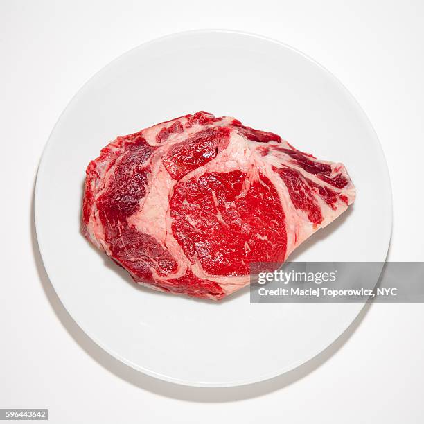 steak on a white plate. - beefsteak 2013 stock pictures, royalty-free photos & images