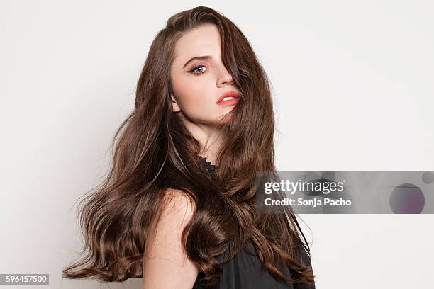 studio portrait of young brunette woman - the long hair stock pictures, royalty-free photos & images