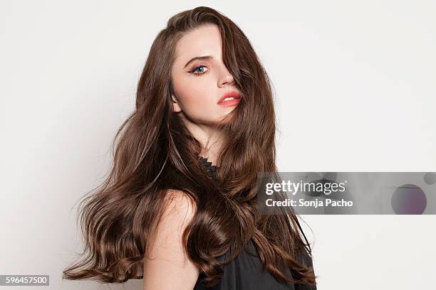 studio portrait of young brunette woman - beautiful hair stock pictures, royalty-free photos & images