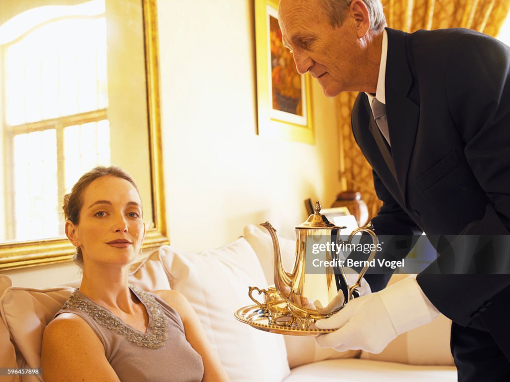 Butler Tea Ritual Butler Bringing Tea To Woman High-Res Stock Photo - Getty Images