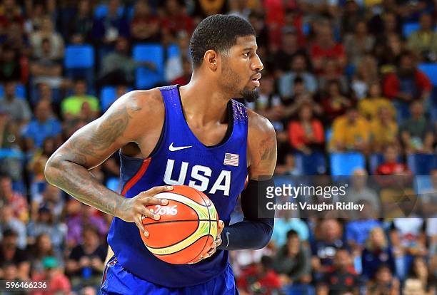Paul George of the USA passes the ball during the Men's Gold medal game between Serbia and the USA on Day 16 of the Rio 2016 Olympic Games at Carioca...