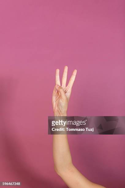 human hand making number - 3 fingers stockfoto's en -beelden