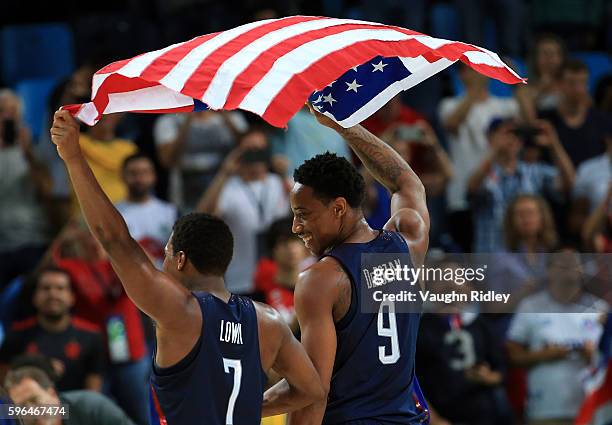 Kyle Lowry and DeMar DeRozan of the USA celebrate after winning the Men's Gold medal game between Serbia and the USA on Day 16 of the Rio 2016...