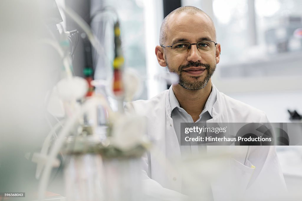Portrait of a male scientist inside a laboratory