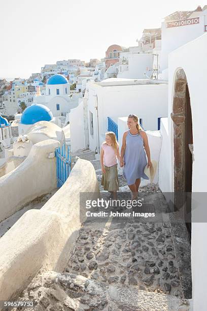mother with daughter walking together - greece tourism stock pictures, royalty-free photos & images