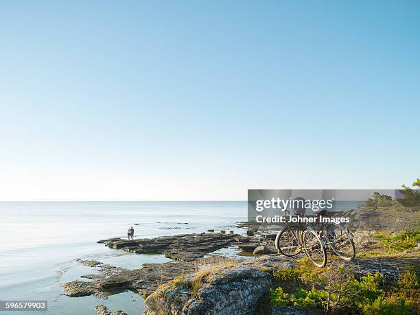 bicycles at sea, people on background - faro sweden bildbanksfoton och bilder