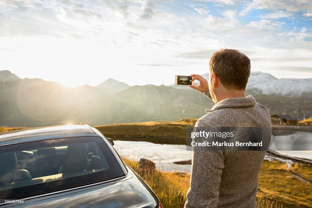 Man taking picture with his cell phone
