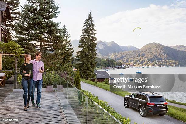 couple walking on terrace - locs hairstyle stockfoto's en -beelden