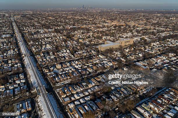 aerial of train tracks through suburb of chicago - chicago neighborhood stock-fotos und bilder