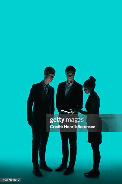 3 young business people in siloette - human interactivity stock pictures, royalty-free photos & images