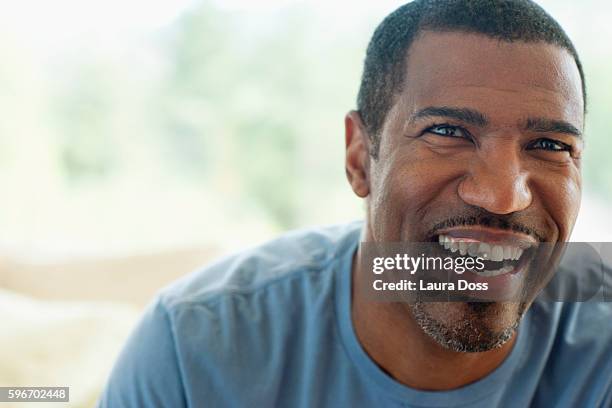 smiling middle-aged man - man 45 stock pictures, royalty-free photos & images