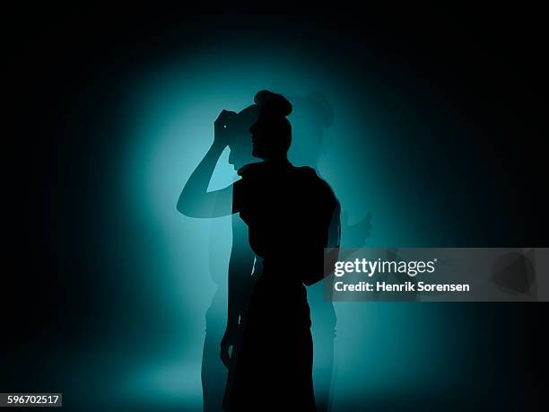 siloette double exposure of young woman - head in hands stock pictures, royalty-free photos & images