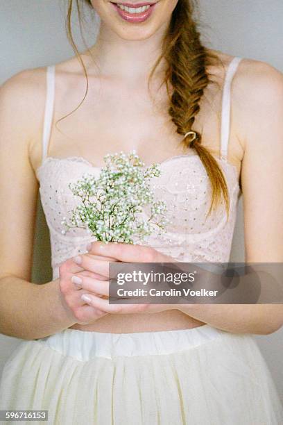 girl with red hair holding white flowers - fishtail braid stock pictures, royalty-free photos & images