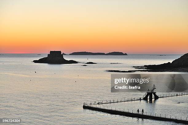 swimming pool at the ocean. - saint malo stock pictures, royalty-free photos & images