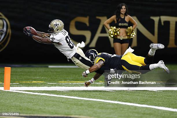 Tommylee Lewis of the New Orleans Saints dives for a touchdown as Jordan Dangerfield of the Pittsburgh Steelers attempts to tackle during the second...