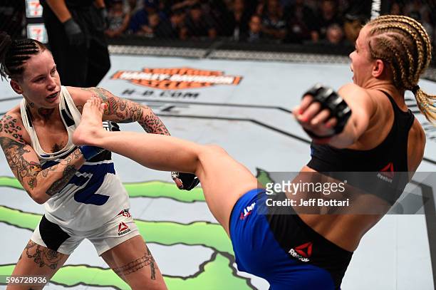 Paige VanZant of the United States kicks Bec Rawlings of Australia in their women's strawweight bout during the UFC Fight Night event at Rogers Arena...