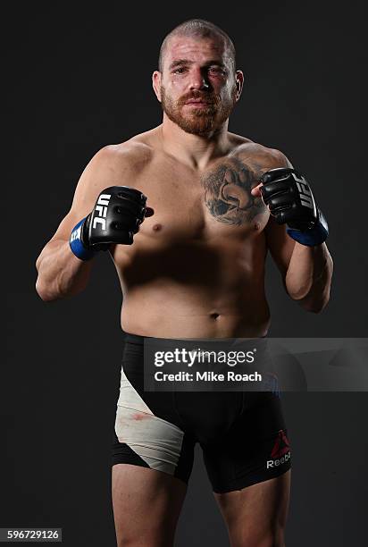 Jim Miller of the United States poses for a post fight portrait backstage during the UFC Fight Night event at Rogers Arena on August 27, 2016 in...