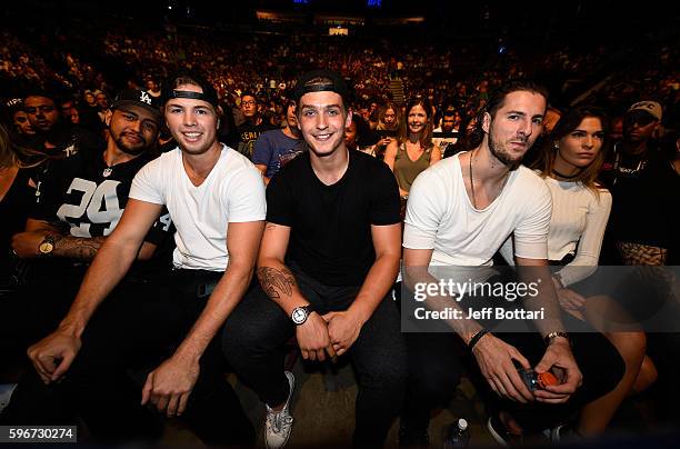 Players Emerson Etem, Ben Hutton, and Jake Virtanen of the Vancouver Canucks pose for a picture during the UFC Fight Night event at Rogers Arena on...