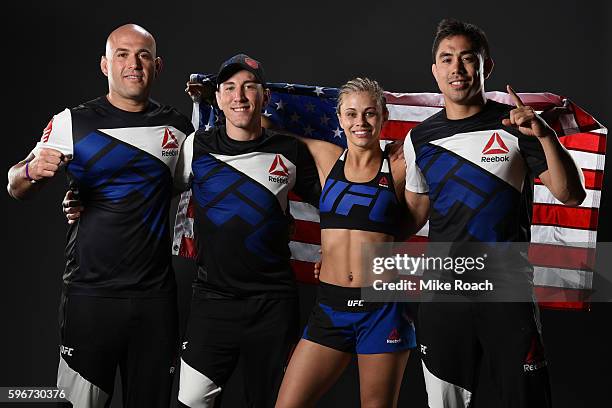 Paige VanZant of the United States poses for a post fight portrait with her team backstage during the UFC Fight Night event at Rogers Arena on August...
