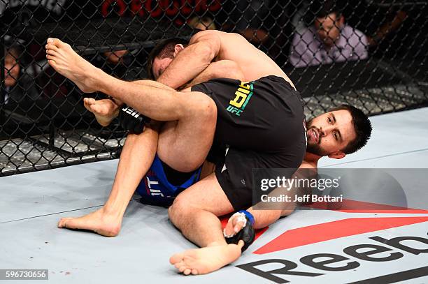 Demian Maia of Brazil controls the body of Carlos Condit of the United States in their welterweight bout during the UFC Fight Night event at Rogers...