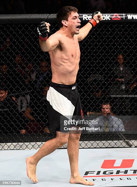 Demian Maia of Brazil celebrates his submission victory over Carlos Condit of the United States in their welterweight bout during the UFC Fight Night...