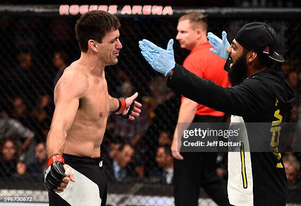 Demian Maia of Brazil celebrates his submission victory over Carlos Condit of the United States in their welterweight bout during the UFC Fight Night...