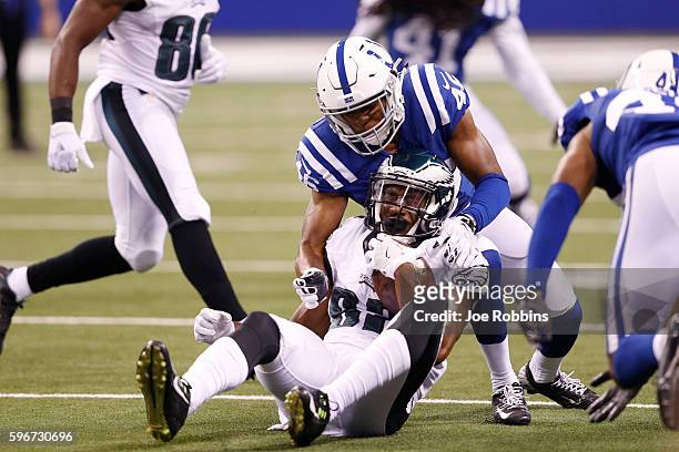 Frankie Williams of the Indianapolis Colts makes a tackle against Rueben Randle of the Philadelphia Eagles in the third quarter of a preseason NFL...