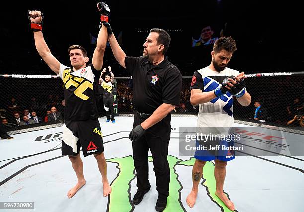 Demian Maia of Brazil celebrates his submission victory over Carlos Condit of the United States in their welterweight bout during the UFC Fight Night...