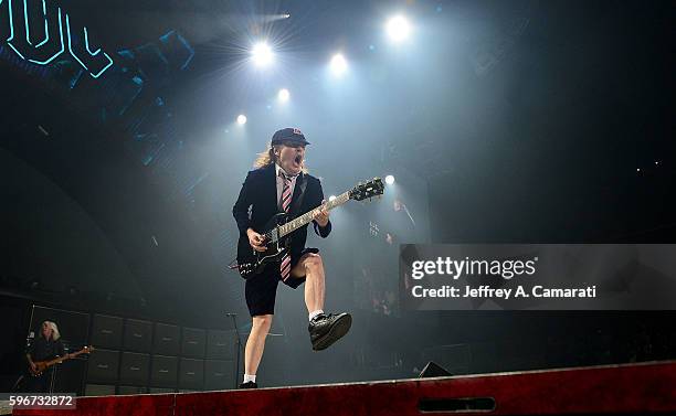 Angus Young performs with AC/DC during the Rock Or Bust Tour at the Greensboro Coliseum on August 27, 2016 in Greensboro, North Carolina.