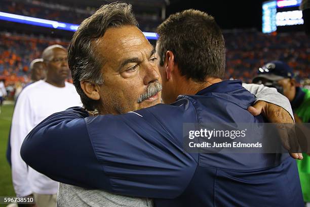 Head coach Jeff Fisher of the Los Angeles Rams hugs head coach Gary Kubiak of the Denver Broncos after their game at Sports Authority Field at Mile...